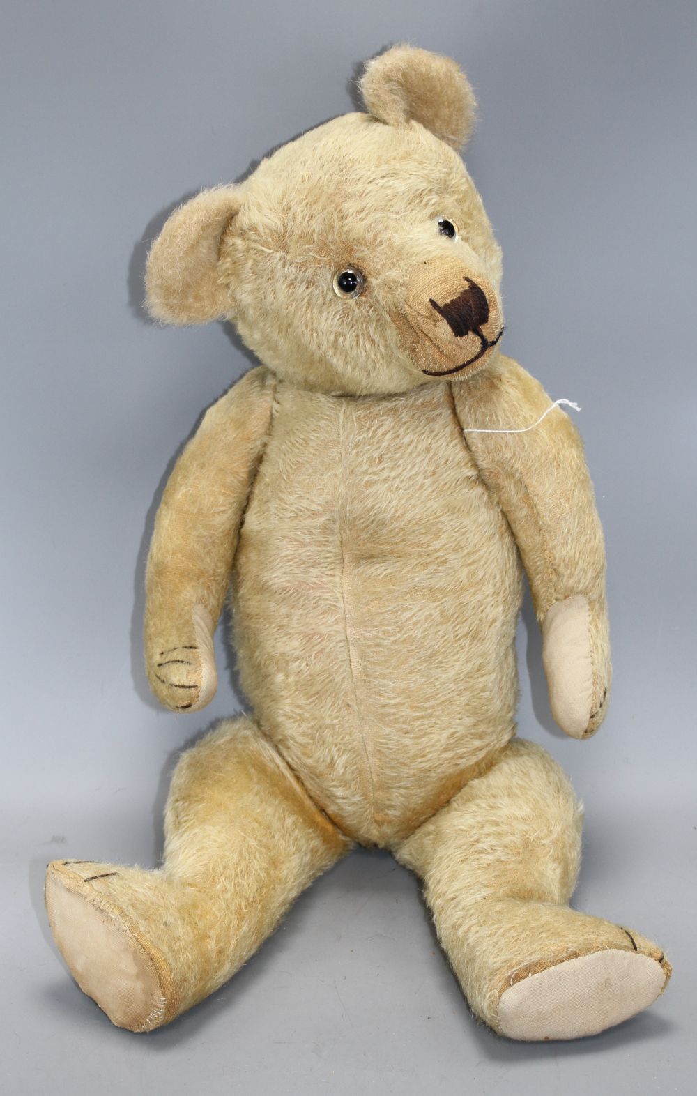 A Chiltern type English bear, c.1930s, 26in., three replaced paw pads, glass eyes